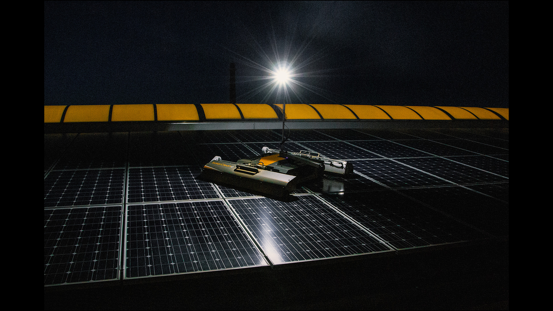 Roof cleaning robot working at night with LED